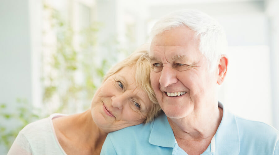 Blog-protecting-ageing-eyes-nutrition-diet-lifestyle-Samer-Hamada-eye-clinic-london An elderly woman leaning her head on her husband's shoulder