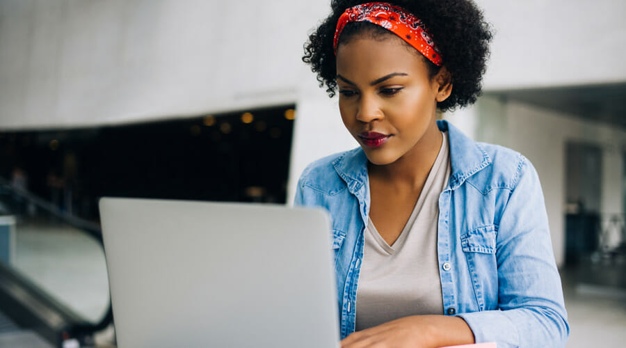 a woman using her laptop