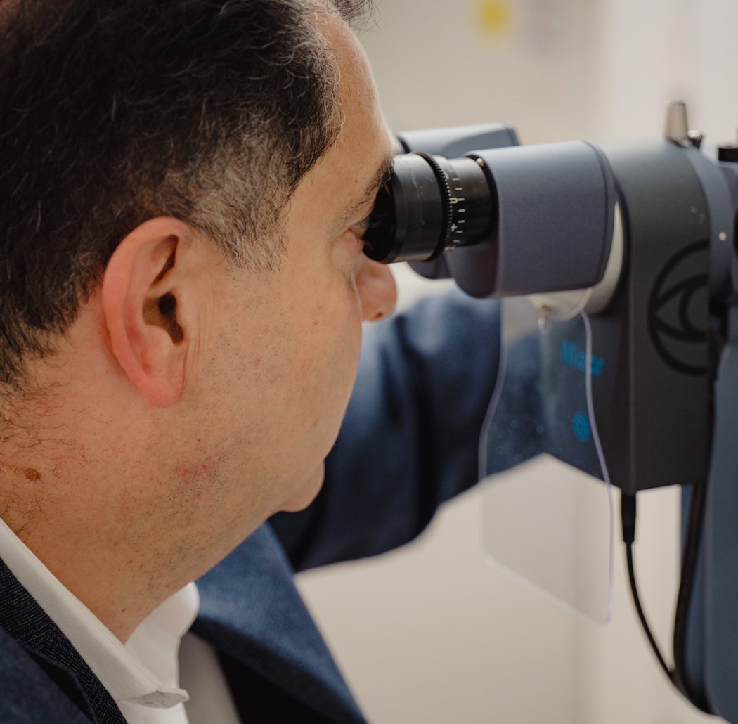 Mr Samer Hamada examining an eyelid at the slit lamp