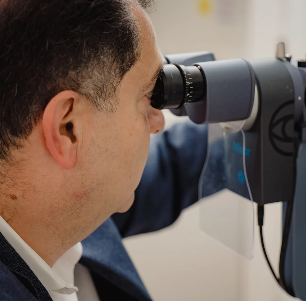 Mr Samer Hamada examining an eyelid at the slit lamp