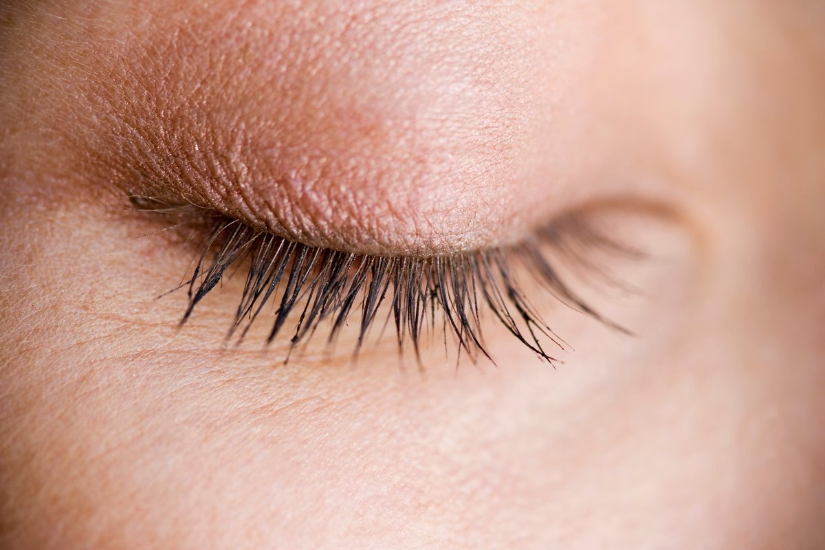 Close-up of a closed eyelid and lashes